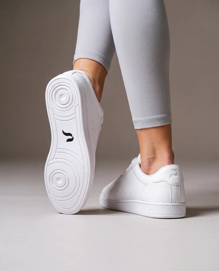Woman in Nova Snow dance sneakers showing the pivot sole
