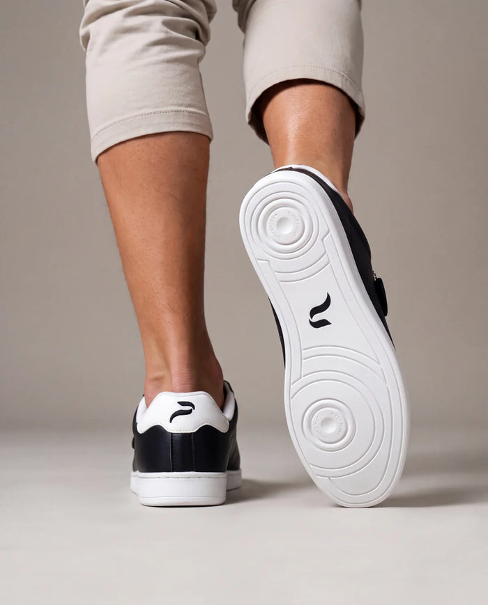 Man in Flow 2 Black dance sneakers showing the pivot sole
