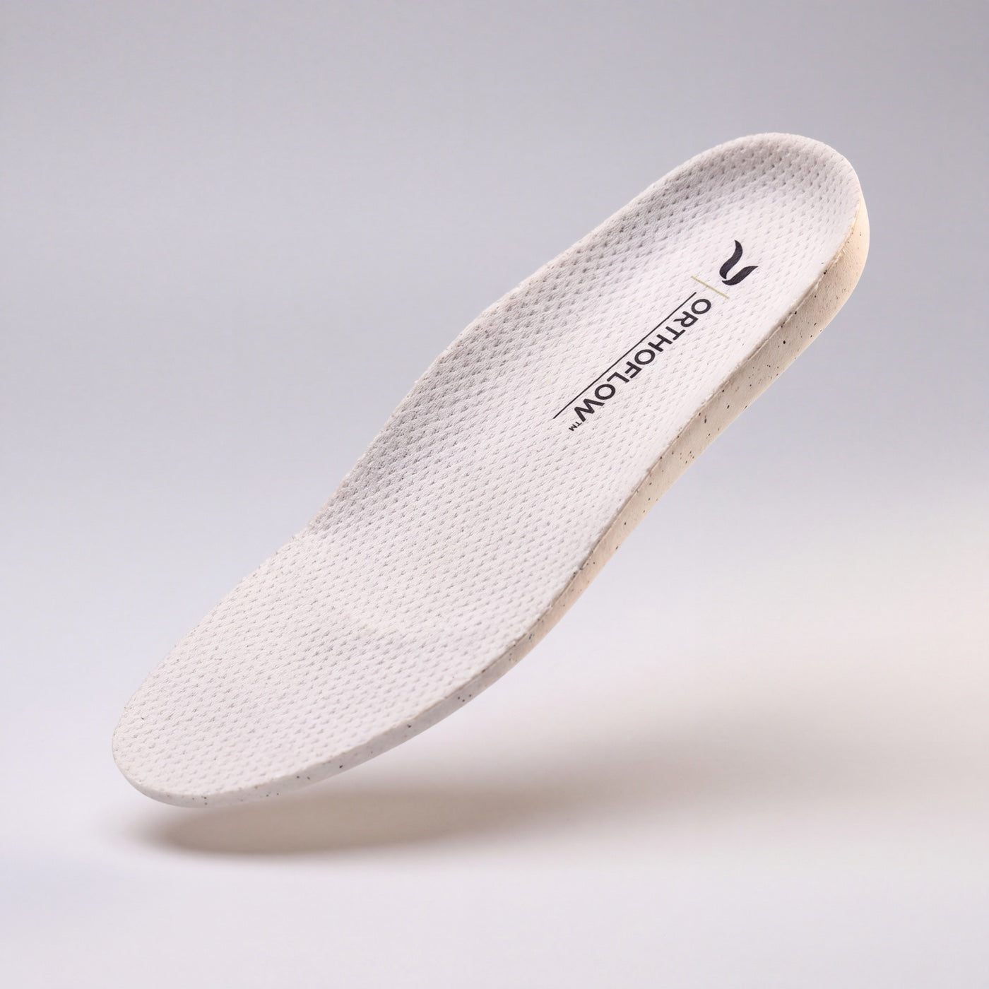 The ORTHOFLOW® insole seen at an angle, showing the arch and heel shaping.